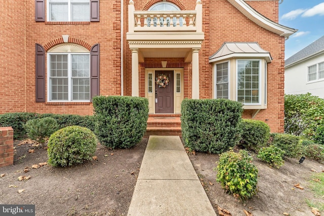 3913 Rolling Paddock Dr, Upper Marlboro, MD 20772 - doorway to property with brick siding, a balcony, and a chimney