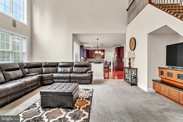 3913 Rolling Paddock Dr, Upper Marlboro, MD 20772 - living room with a towering ceiling, light colored carpet, recessed lighting, and baseboards