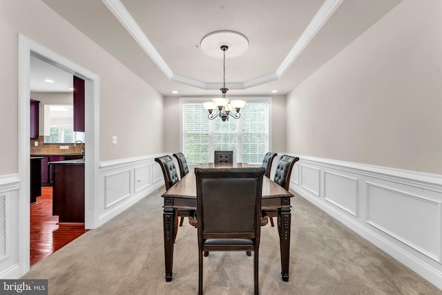 3913 Rolling Paddock Dr, Upper Marlboro, MD 20772 - dining area with a decorative wall, plenty of natural light, a wainscoted wall, ornamental molding, and a tray ceiling