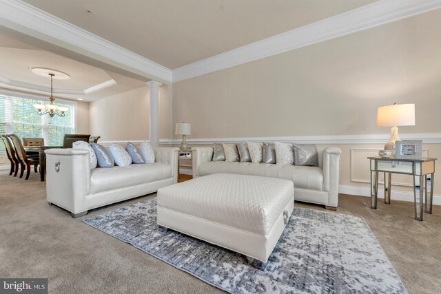 3913 Rolling Paddock Dr, Upper Marlboro, MD 20772 - carpeted living room with crown molding, a chandelier, decorative columns, and a tray ceiling