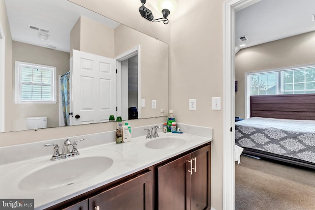 3913 Rolling Paddock Dr, Upper Marlboro, MD 20772 - ensuite bathroom with double vanity, plenty of natural light, and toilet