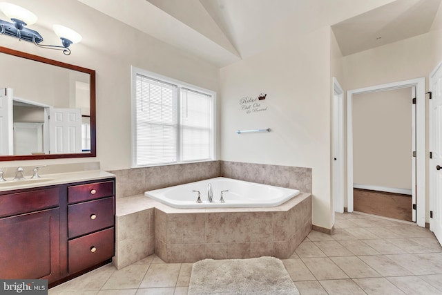 3913 Rolling Paddock Dr, Upper Marlboro, MD 20772 - bathroom with tile patterned flooring, a bath, vanity, and lofted ceiling