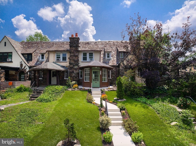 142 Edgehill Rd, Bala Cynwyd, PA 19004 - view of front facade featuring stone siding, stucco siding, a chimney, and a high end roof