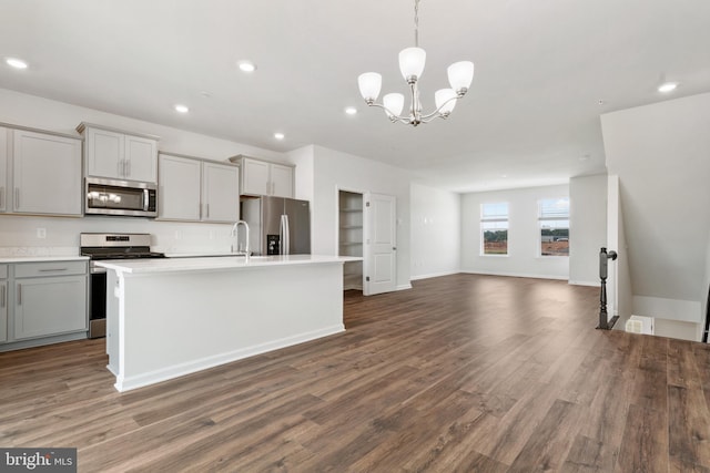 7417 Calm Retreat Blvd, Brandywine, MD 20613 - kitchen with stainless steel appliances, recessed lighting, open floor plan, gray cabinetry, and a kitchen island with sink