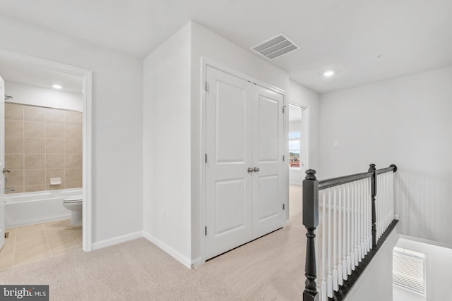 7417 Calm Retreat Blvd, Brandywine, MD 20613 - hallway with an upstairs landing, baseboards, tile patterned flooring, recessed lighting, and carpet