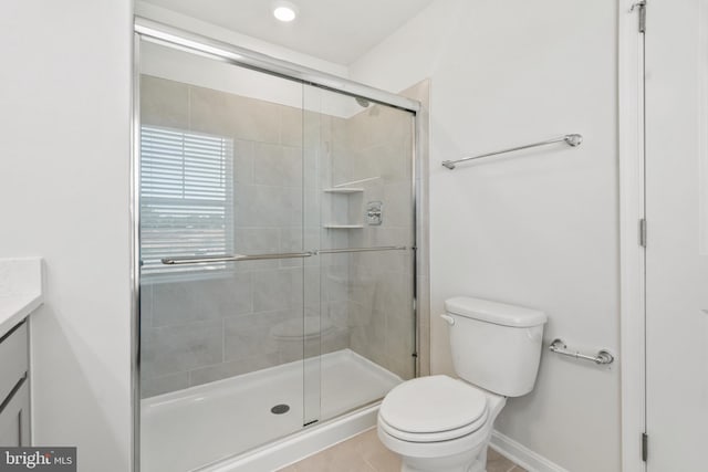 7417 Calm Retreat Blvd, Brandywine, MD 20613 - bathroom with vanity, toilet, a stall shower, and tile patterned flooring