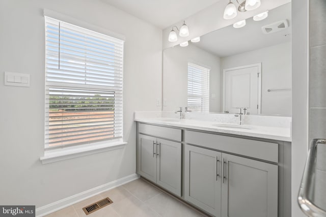 7417 Calm Retreat Blvd, Brandywine, MD 20613 - bathroom with baseboards, double vanity, healthy amount of natural light, and tile patterned flooring