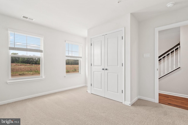 7417 Calm Retreat Blvd, Brandywine, MD 20613 - unfurnished bedroom with carpet, a closet, and baseboards