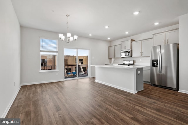 7417 Calm Retreat Blvd, Brandywine, MD 20613 - kitchen featuring stainless steel appliances, gray cabinets, a chandelier, light countertops, and dark wood-style floors
