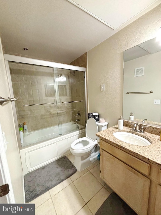 1581 Spring Gate Dr Unit 5207, Mclean, VA 22102 - full bathroom featuring vanity, toilet, a textured wall, combined bath / shower with glass door, and tile patterned flooring