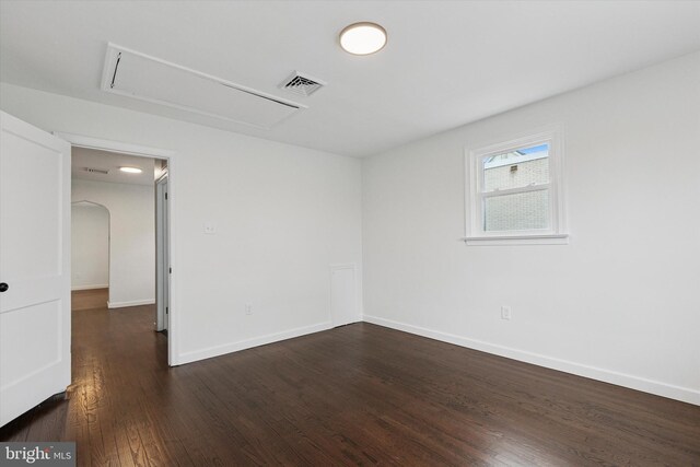 1631 Old Schuylkill Rd, Spring City, PA 19475 - spare room featuring attic access, dark wood-style flooring, and arched walkways