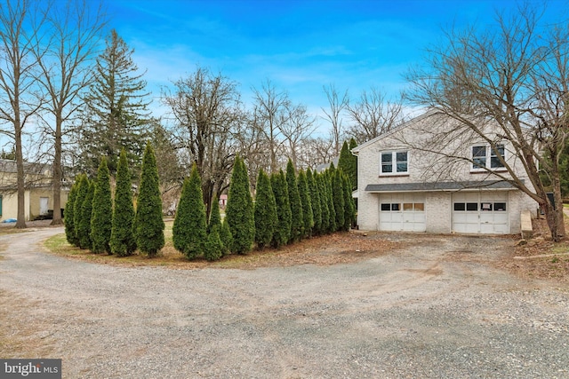 1631 Old Schuylkill Rd, Spring City, PA 19475 - view of side of home with driveway, a garage, and brick siding