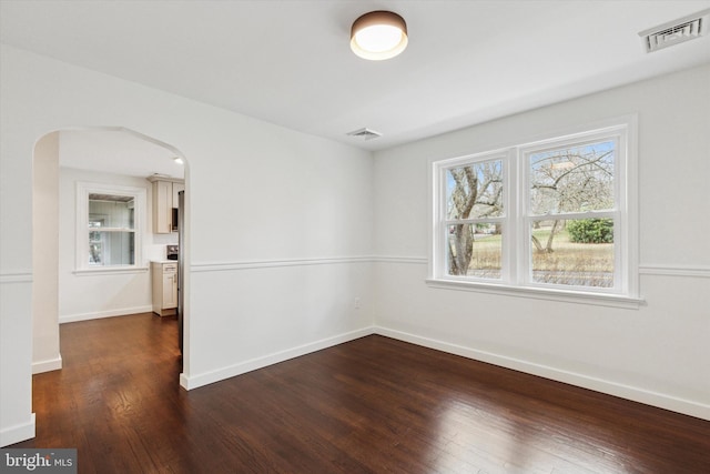 1631 Old Schuylkill Rd, Spring City, PA 19475 - empty room featuring arched walkways and dark wood-style flooring