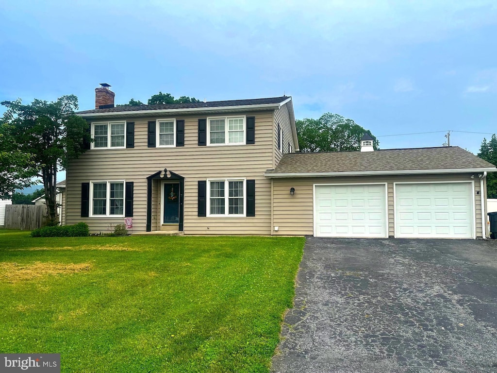 7 Victor Dr, Thurmont, MD 21788 - colonial home featuring a chimney, driveway, and a garage
