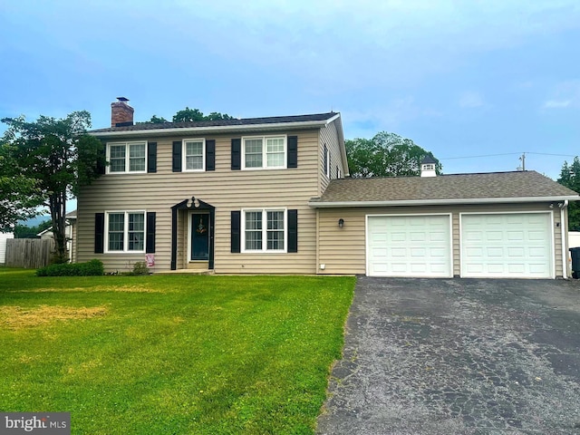 7 Victor Dr, Thurmont, MD 21788 - colonial home featuring a chimney, driveway, and a garage