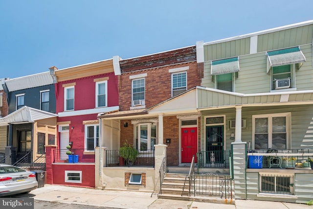 1523 N Hollywood St, Philadelphia, PA 19121 - townhome / multi-family property with a porch and brick siding