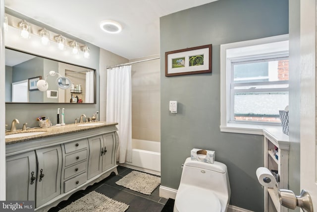1523 N Hollywood St, Philadelphia, PA 19121 - full bathroom with toilet, double vanity, shower / bath combo with shower curtain, tile patterned flooring, and baseboards