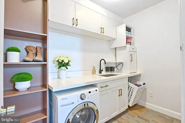 1523 N Hollywood St, Philadelphia, PA 19121 - laundry room with washer / clothes dryer, cabinet space, light wood-style flooring, and baseboards