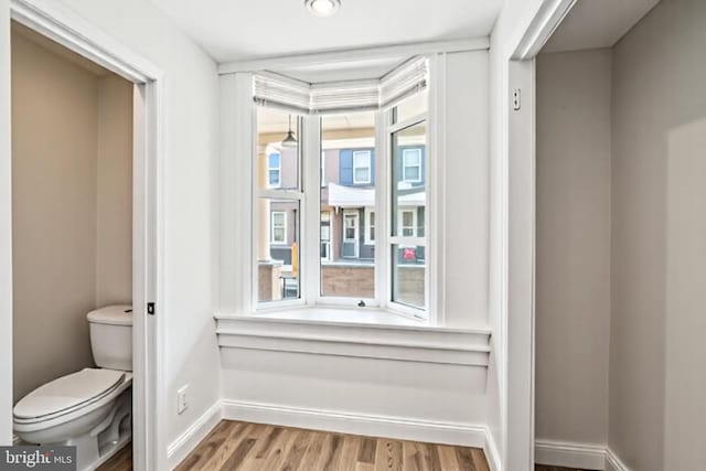 1523 N Hollywood St, Philadelphia, PA 19121 - bathroom with toilet, wood finished floors, and baseboards