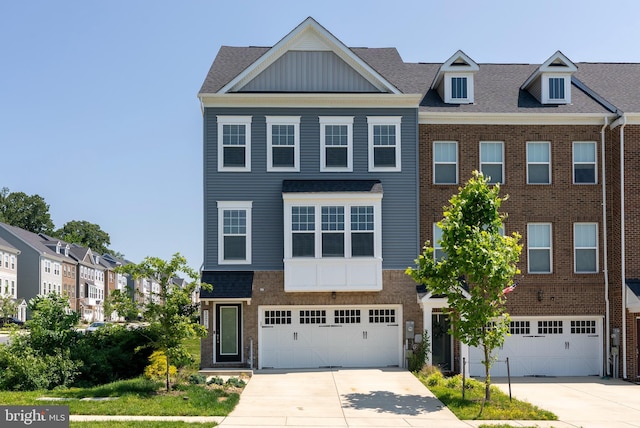 2270 Haw River Rd, Hanover, MD 21076 - townhome / multi-family property featuring concrete driveway, a garage, and board and batten siding