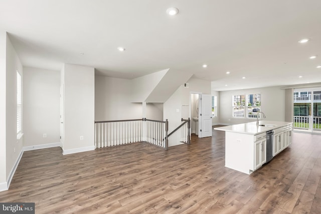 2270 Haw River Rd, Hanover, MD 21076 - kitchen with a sink, wood finished floors, open floor plan, recessed lighting, and white cabinetry