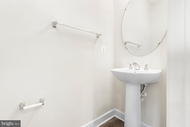 2270 Haw River Rd, Hanover, MD 21076 - bathroom with baseboards, wood finished floors, and a sink