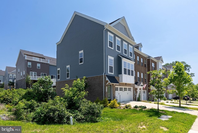 2270 Haw River Rd, Hanover, MD 21076 - view of side of property featuring an attached garage, concrete driveway, and a residential view