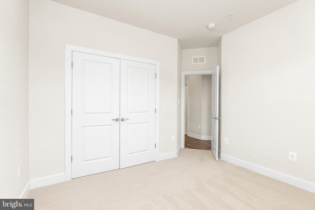 2270 Haw River Rd, Hanover, MD 21076 - unfurnished bedroom featuring light colored carpet, a closet, and baseboards