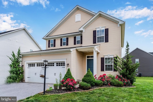 11 Kestrel Dr, Mechanicsburg, PA 17050 - traditional-style house featuring a front yard and asphalt driveway