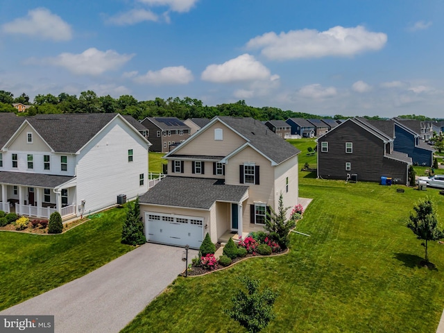 11 Kestrel Dr, Mechanicsburg, PA 17050 - traditional-style house featuring asphalt driveway, a residential view, a garage, and a front yard
