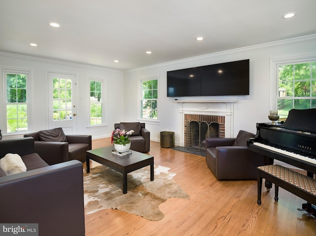 745 Conestoga Rd, Bryn Mawr, PA 19010 - living room featuring ornamental molding, light wood-style flooring, a fireplace, and recessed lighting