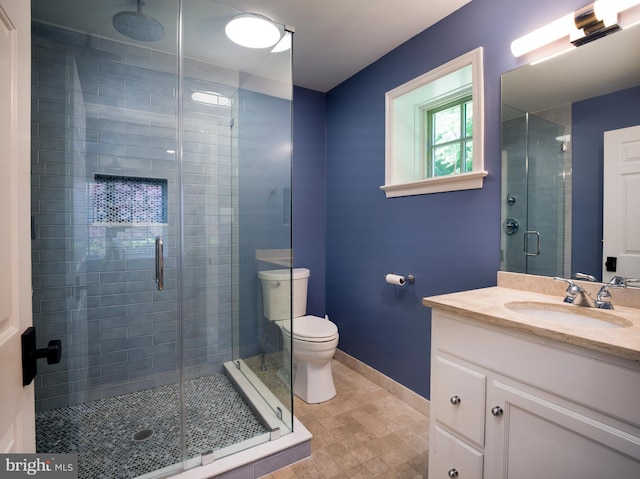 745 Conestoga Rd, Bryn Mawr, PA 19010 - bathroom with vanity, toilet, a shower stall, and baseboards