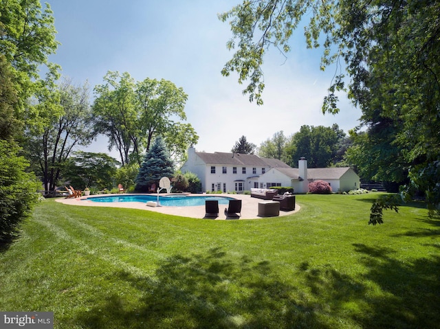 745 Conestoga Rd, Bryn Mawr, PA 19010 - back of house featuring an outdoor living space, an outdoor pool, a yard, and a patio