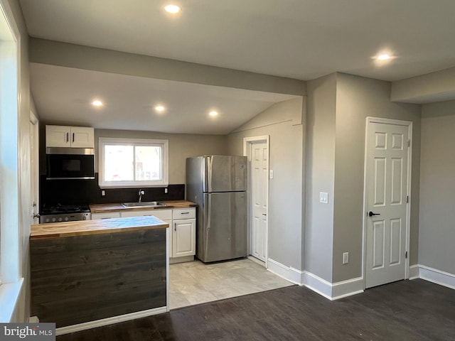 300 Darcy Ave, Hamilton, NJ 08629 - kitchen featuring appliances with stainless steel finishes, wooden counters, light wood-style flooring, white cabinetry, and recessed lighting