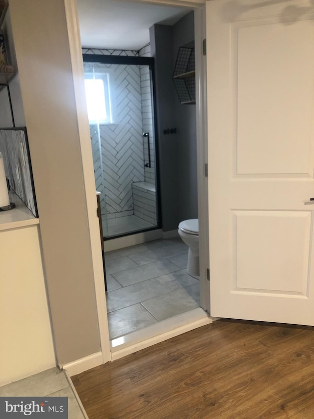 300 Darcy Ave, Hamilton, NJ 08629 - full bath with a stall shower, toilet, and wood finished floors
