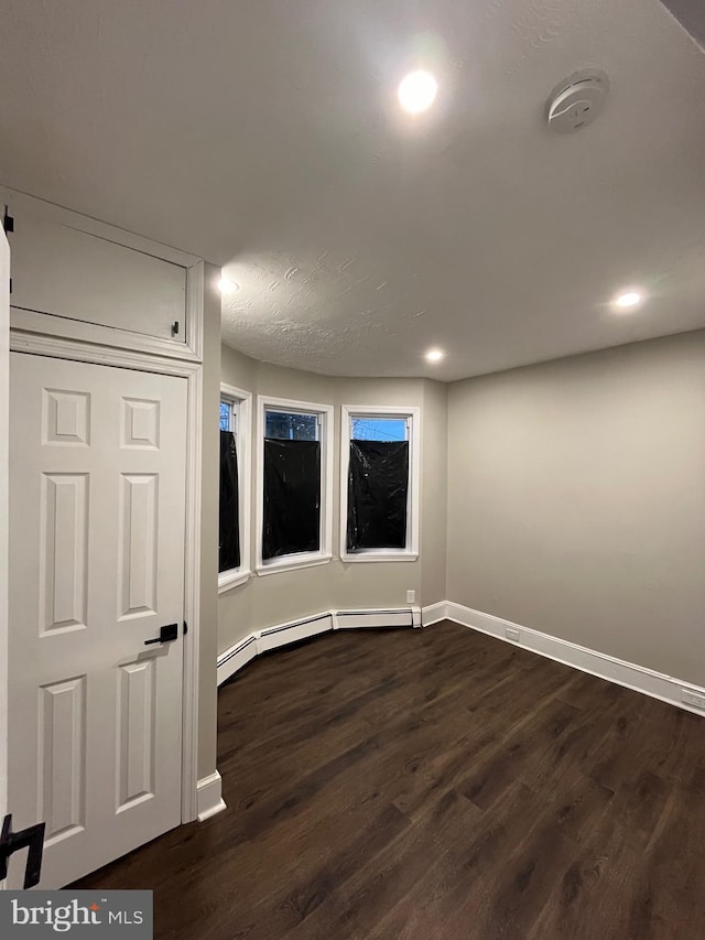 300 Darcy Ave, Hamilton, NJ 08629 - spare room with baseboards, dark wood-type flooring, recessed lighting, a smoke detector, and baseboard heating