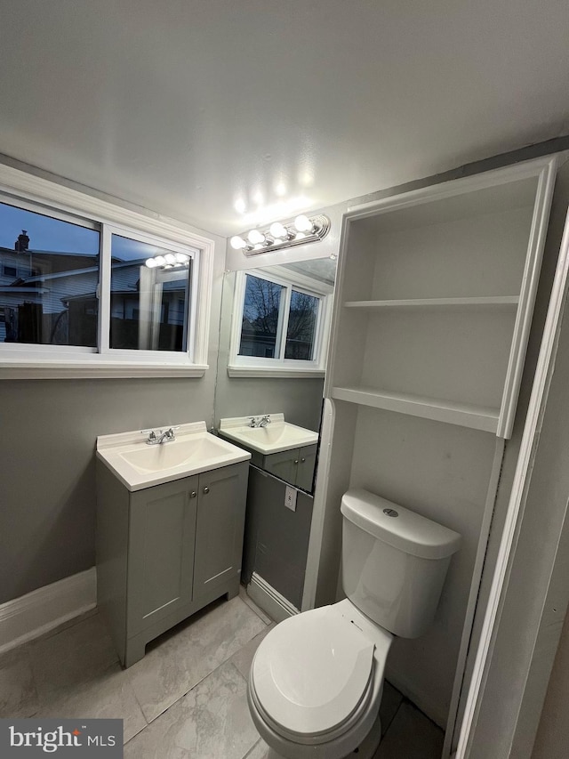 300 Darcy Ave, Hamilton, NJ 08629 - bathroom with baseboards, vanity, toilet, and marble finish floors