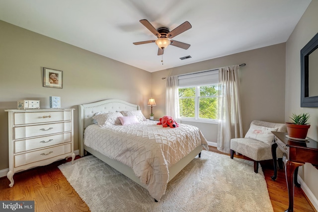 15220 Highview Ct, Waterford, VA 20197 - bedroom with wood finished floors, baseboards, and a ceiling fan