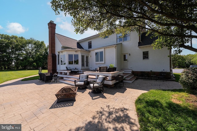 15220 Highview Ct, Waterford, VA 20197 - rear view of house with a patio area, a chimney, a lawn, a shingled roof, and an outdoor living space with a fire pit