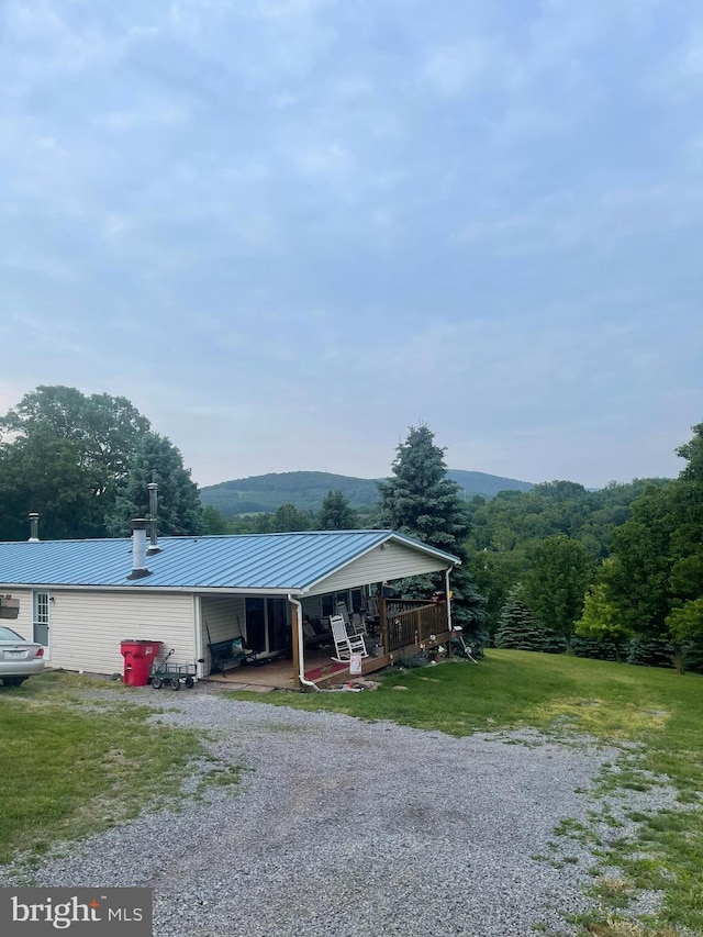 785 Pear Ln, Romney, WV 26757 - view of front of house with a metal roof, driveway, and a front lawn