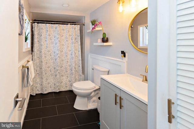 412 Horace Ave, Palmyra, NJ 08065 - bathroom with tile patterned floors, toilet, vanity, and healthy amount of natural light