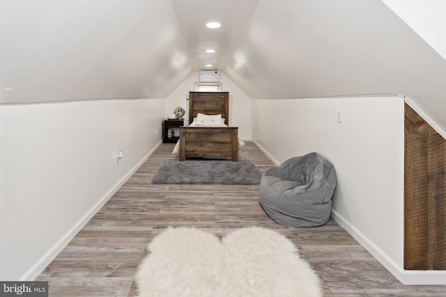 412 Horace Ave, Palmyra, NJ 08065 - bedroom featuring wood finished floors, vaulted ceiling, baseboards, and an AC wall unit