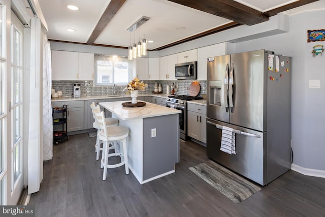 412 Horace Ave, Palmyra, NJ 08065 - kitchen featuring stainless steel appliances, a sink, dark wood-type flooring, beamed ceiling, and tasteful backsplash