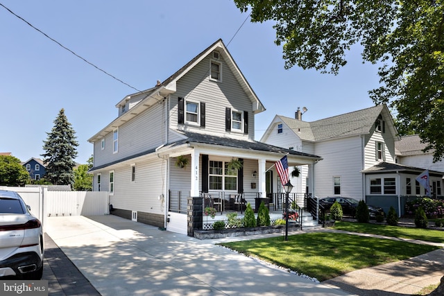 412 Horace Ave, Palmyra, NJ 08065 - traditional style home featuring covered porch, a gate, and driveway