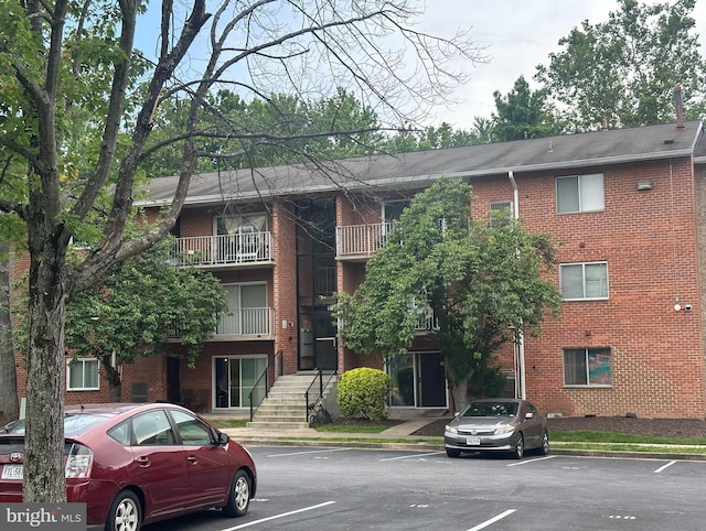7971 Audubon Ave Unit 202, Alexandria, VA 22306 - view of building exterior featuring uncovered parking