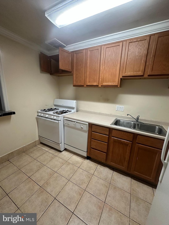 7971 Audubon Ave Unit 202, Alexandria, VA 22306 - kitchen with white appliances, a sink, crown molding, light tile patterned floors, and light countertops