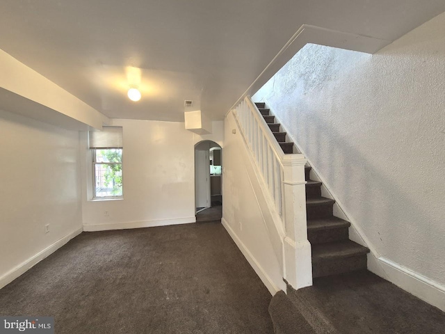 507 Newton Ave, Camden, NJ 08103 - stairway with arched walkways, baseboards, and carpet flooring