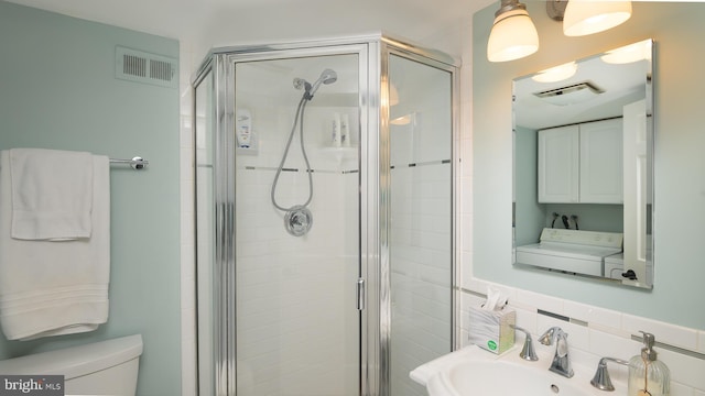 4421 36th St S, Arlington, VA 22206 - bathroom with a stall shower and independent washer and dryer