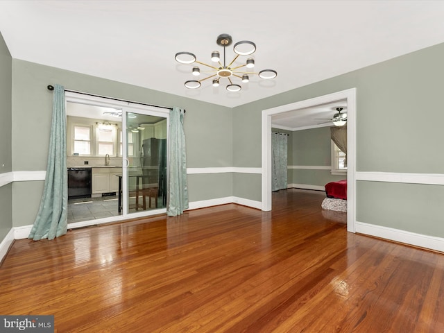 19330 Longmeadow Rd, Hagerstown, MD 21742 - empty room featuring a chandelier, wood finished floors, a sink, baseboards, and ceiling fan
