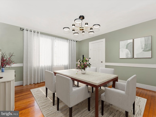 19330 Longmeadow Rd, Hagerstown, MD 21742 - dining area with a chandelier, light wood-style flooring, and baseboards